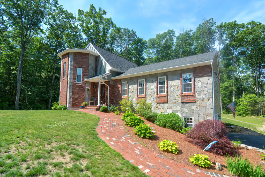 stone-faced home with brick accents