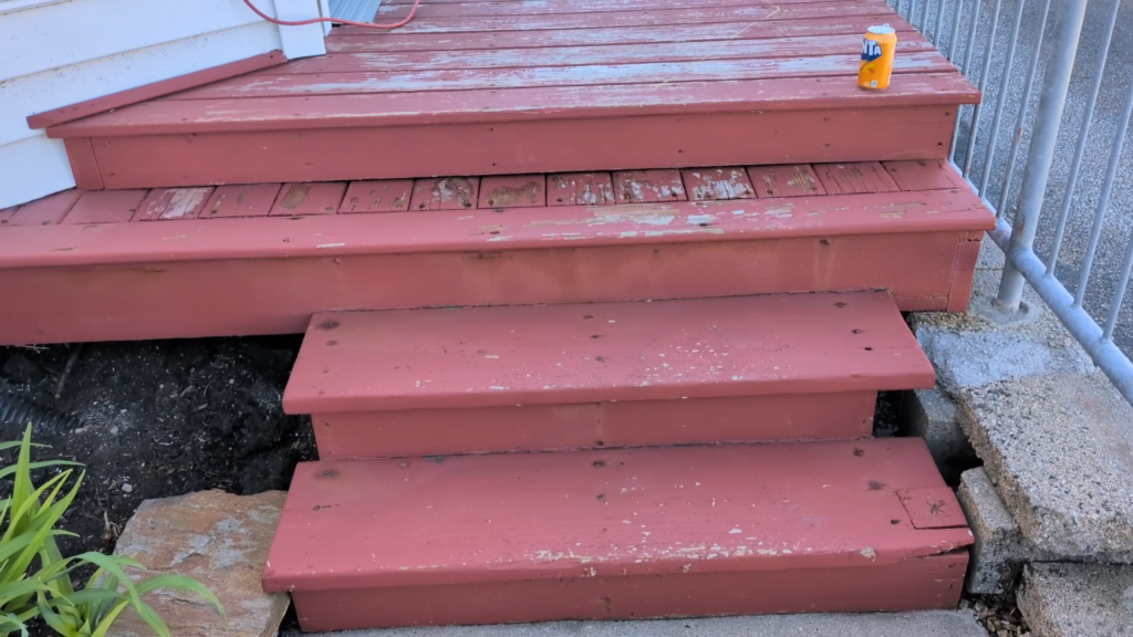 red stained wooden steps leading to deck