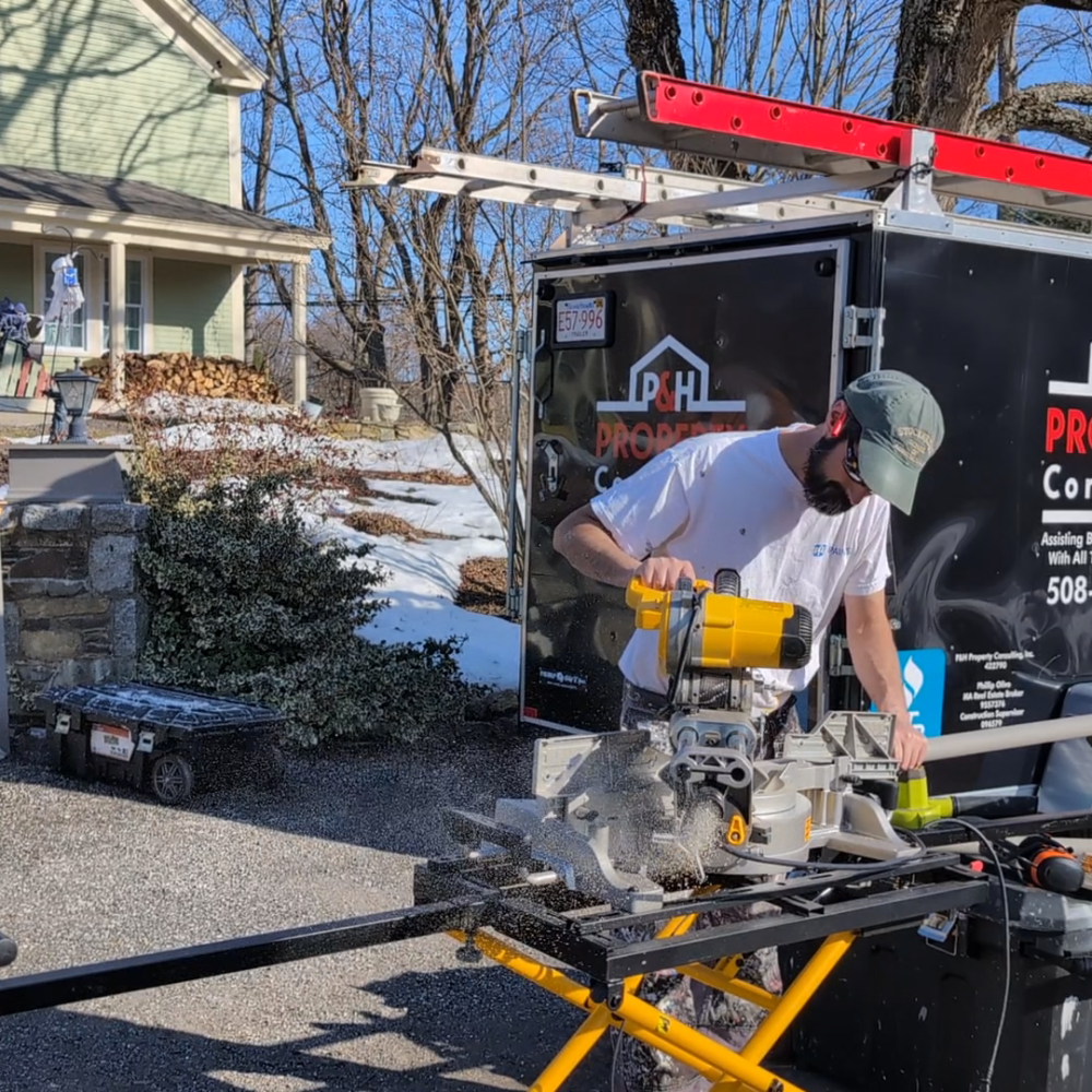 man using chop saw working on home repairs